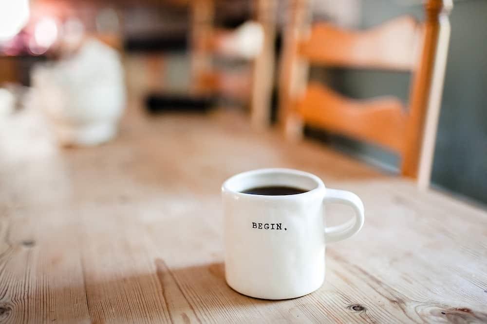 Mug with &ldquo;begin&rdquo; written on it