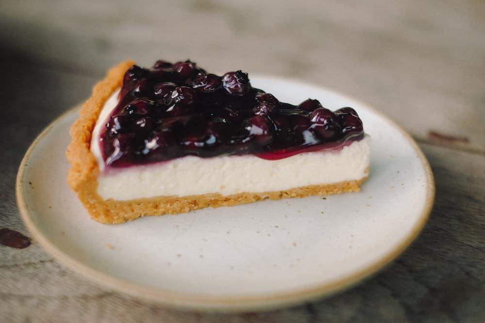 Blueberry cheesecake on ceramic plate